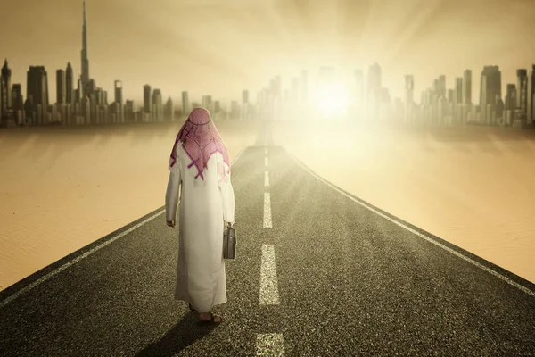 Arabic entrepreneur walking on road — Stock Photo, Image