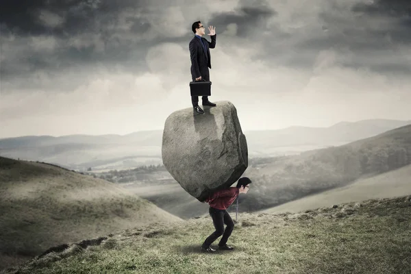 Businessman and partner with burden in the hill — Stock Photo, Image