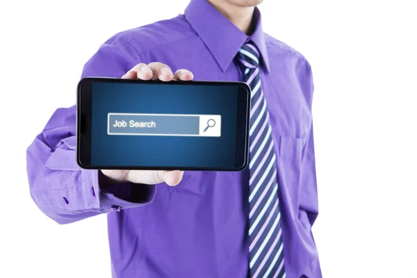 Businessman showing mobile phone in the studio — Stock Photo, Image