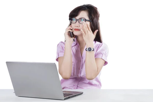 Attractive woman using mobile phone and laptop — Stock Photo, Image