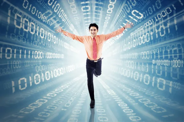 Male entrepreneur running with binary code — Stock Photo, Image