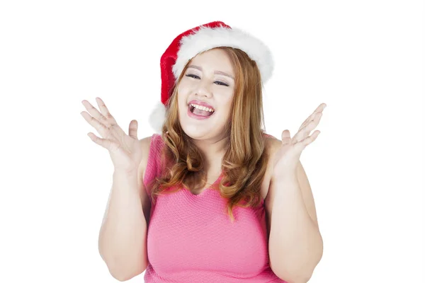 Surprised fat woman wearing christmas hat — Stock Photo, Image
