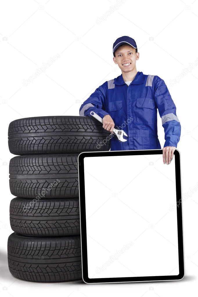 Technician holding wrench and empty board