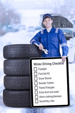 Yönetim Kurulu ve açık havada lastikleri ile teknisyen