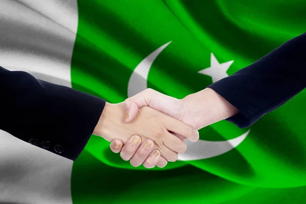 Találkozó a kézfogás a Pakisztán zászlaja — Stock Fotó