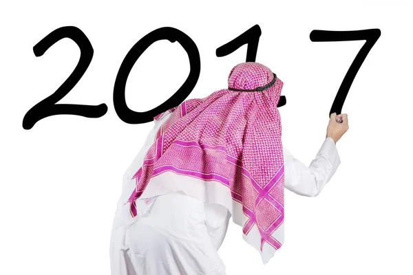 Arabian businessman writes number 2017 with marker — Stock Photo, Image