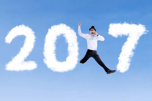 Businessman jumping with 2017 — Stock Photo, Image