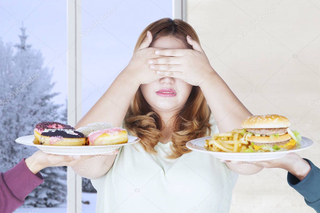 Beautiful woman refuses junk food 