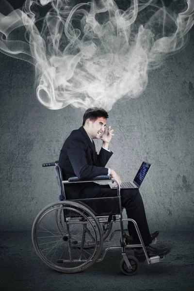 Handicap businessman expressing anger with smoke — Stock Photo, Image