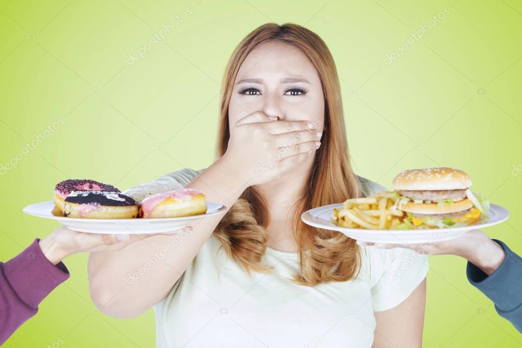 Fat woman rejects high calorie food 