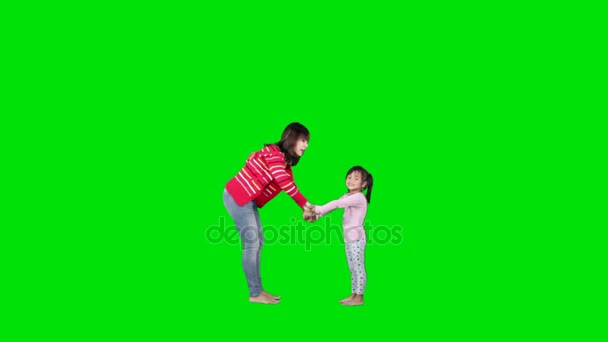 Criança e mãe pulando em estúdio — Vídeo de Stock