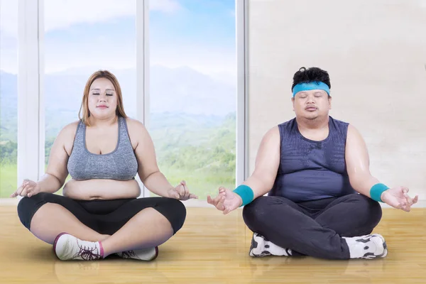 Obese group people meditating indoors — Stock Photo, Image