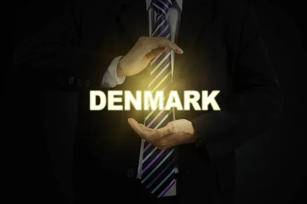 Две руки, защищающие датское слово — стоковое фото