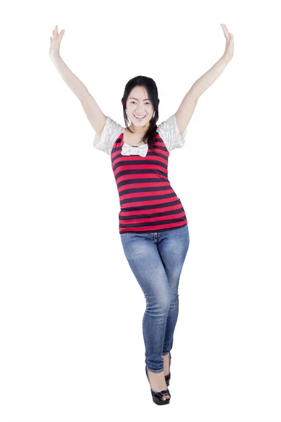 Cheerful woman raising hands on studio — Stock Photo, Image