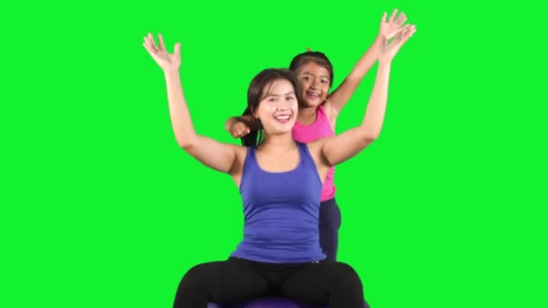 Cheerful mother and girl in studio — Stock Video