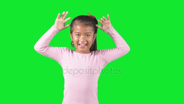 Child playing in studio with silly face — Stock Video