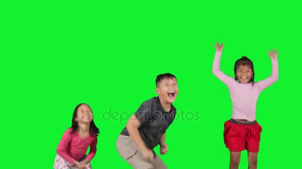 Cute children jumping in studio — Stock Video