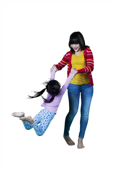 Girl and mother playing in studio — Stock Photo, Image