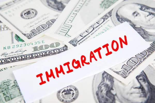 Dollar munt met immigratie woord — Stockfoto