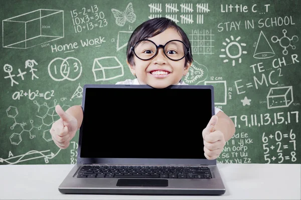 Cheerful student with laptop shows hand gesture — Stock Photo, Image