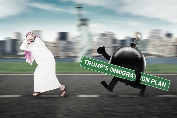 Arabian immigrant running away from a bomb — Stock Photo, Image