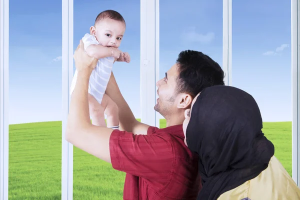 Happy father holding his baby at home — Stock Photo, Image