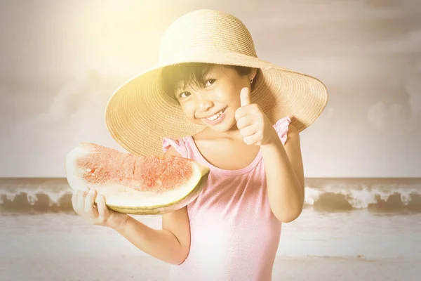 Happy girl holding a watermelon — Stock Photo, Image