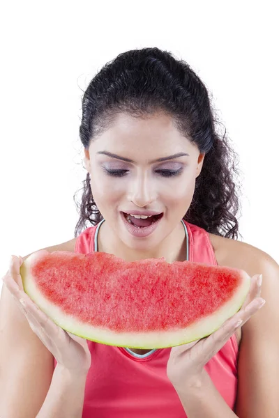 Indian woman eating sweet watermelon on studio — Stock Photo, Image