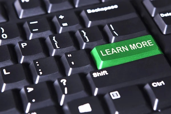 Computer keyboard with text of learn more — Stock Photo, Image