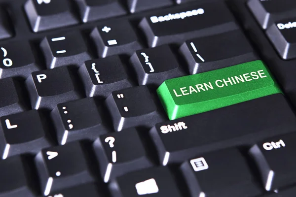 Gröna knappen med texten lär dig kinesiska — Stockfoto