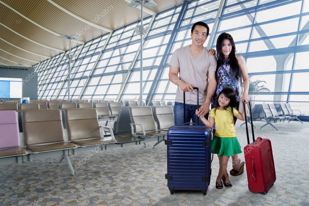 Happy family smiling in airport