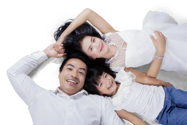 Asian family lying on the floor — Stock Photo, Image