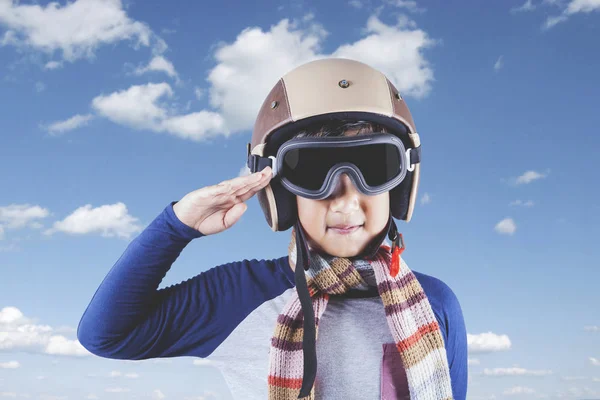 Child with helmet and saluting gesture — Stock Photo, Image