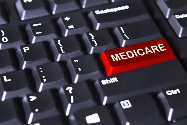 Medicare word on the red button — Stock Photo, Image