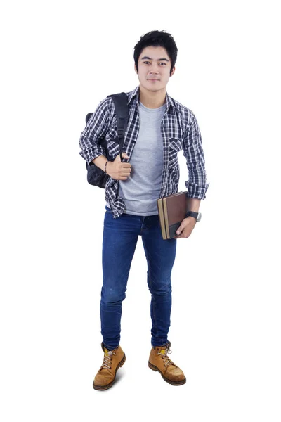 Mannelijke student met rugzak en boeken — Stockfoto