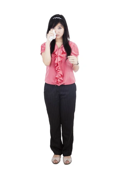 Sad businesswoman crying in studio — Stock Photo, Image