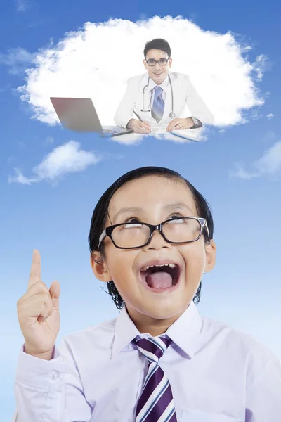 Elementary student is imagining his dream — Stock Photo, Image