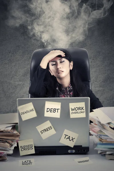 Stressful worker with smoke on head