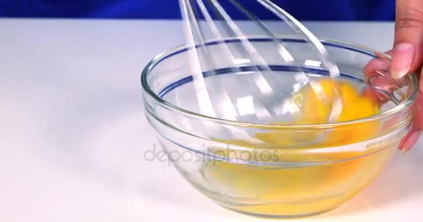 Woman hands mixing egg in bowl — Stock Video