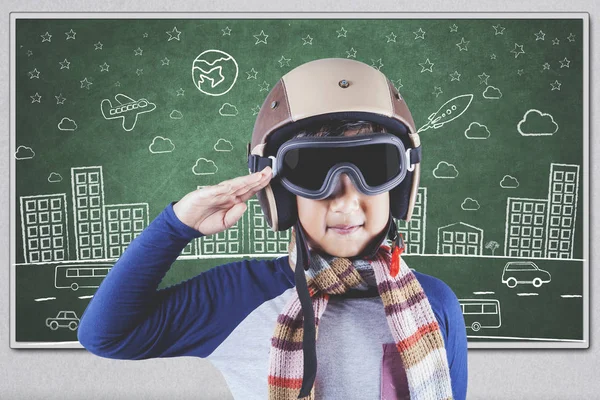 Boy with an aviator helmet in class — Stock Photo, Image