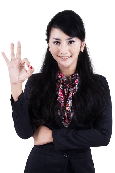 Businesswoman making an ok sign — Stock Photo, Image