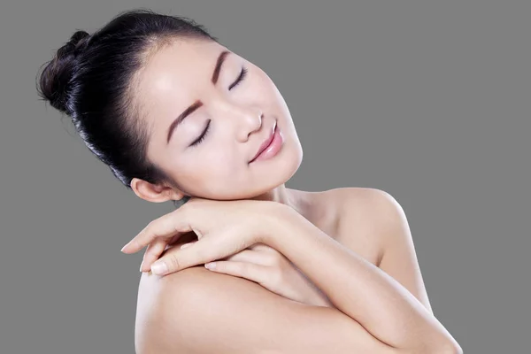 Chinese woman relaxing after skincare — Stock Photo, Image