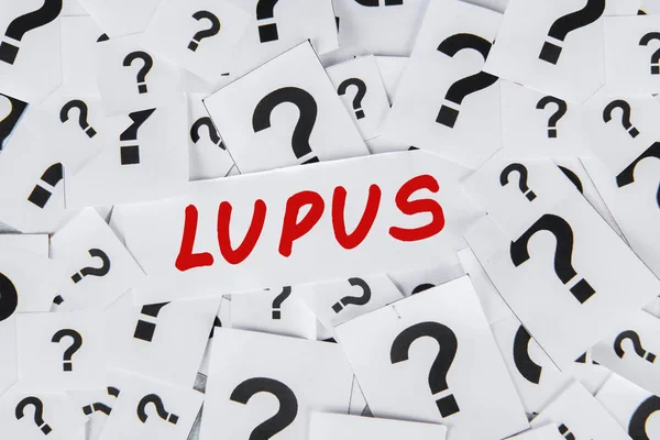 Frågetecken och Lupus word — Stockfoto