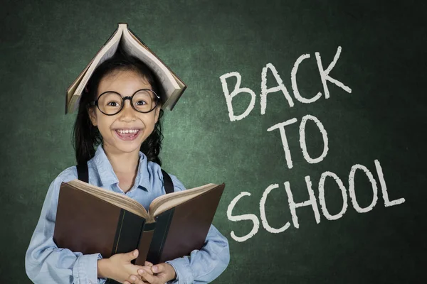 Cute student with back to school text — Stock Photo, Image