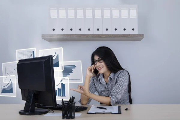 Successful businesswoman with virtual growth graphs — Stock Photo, Image