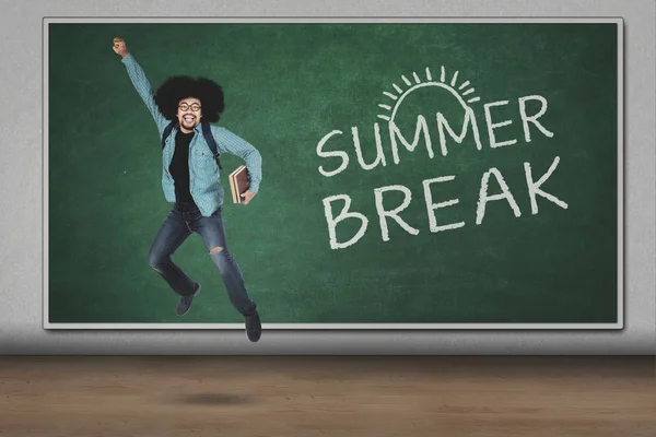 Afro guy leaping with summer break word — Stock Photo, Image