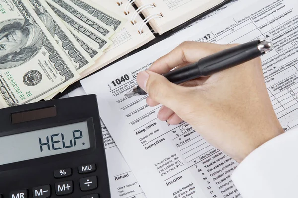 Hands of businessman are filing tax form — Stock Photo, Image