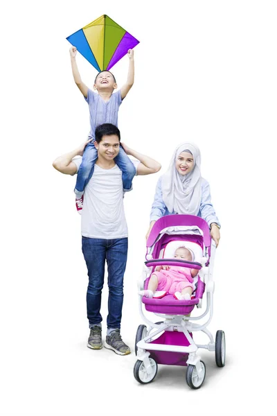 Parents with son and baby in pram — Stock Photo, Image