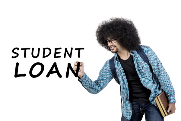 Young man writing student loan word — Stock Photo, Image