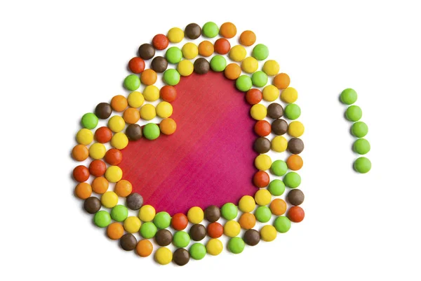 Kleurrijke snoepjes vormige liefde symbool — Stockfoto
